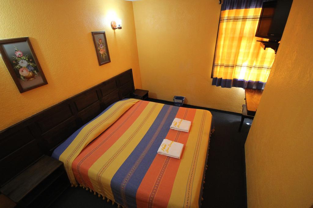Hotel Plaza Santo Domingo Сан-Крістобаль-де-лас-Касас Номер фото